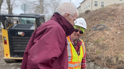 Lynn Watson, Watson Excavating talks to a construction foreman