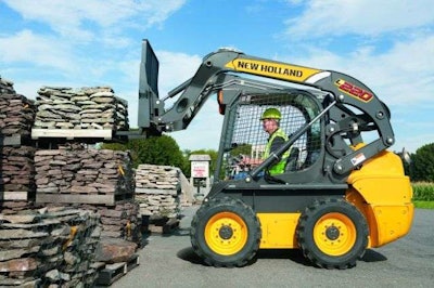 New Holland L220 Skid Steer lifting a pallet of landscaping materials