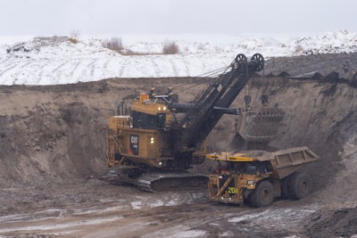 Cat mining truck being filled.