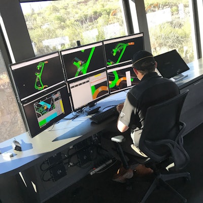 Caterpillar multiple screens tracking truck movements