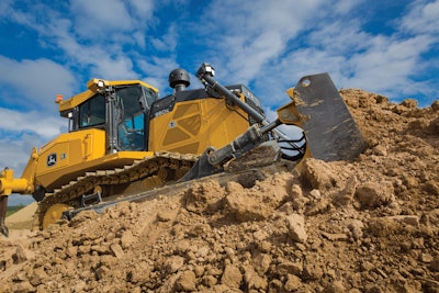 John Deere 950K dozer on hill pushing dirt