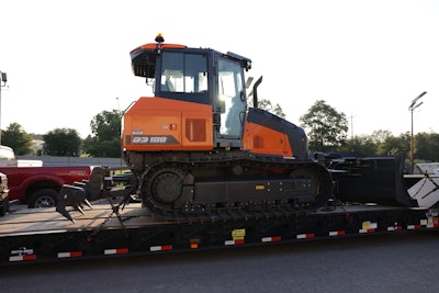 new Doosan DD100 dozer on trailer being delivered