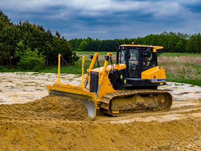 Dressta TD-15M dozer pushing dirt with 3D grade control