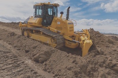 Komatsu D71PXi-24 dozer pushing dirt down hill