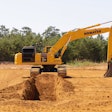 Komatsu PC490LCi-11 iMC 2.0 excavator digging a trench