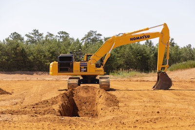 Komatsu PC490LCi-11 iMC 2.0 excavator digging a trench