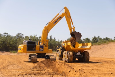 Komatsu PC490LCi-11 iMC2.0 excavator loading a truck