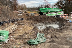 scene of bridge collapse Clay County Missouri red crane in background