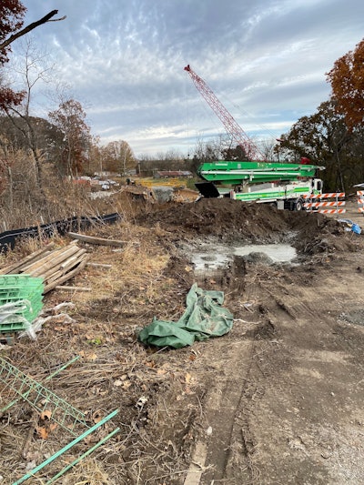 scene of bridge collapse Clay County Missouri red crane in background
