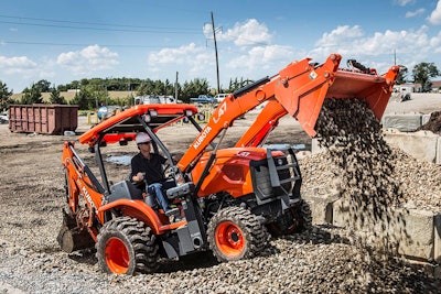 Kubota L47 Tractor Loader Backhoe dumping rocks