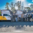 United Construction & Forestry staff in front of a Wirtgen milling machine