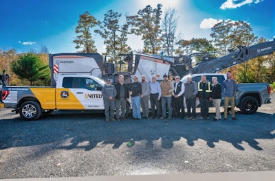 United Construction & Forestry staff in front of a Wirtgen milling machine