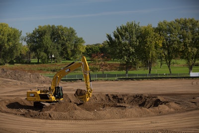 Cat 340 hydraulic excavator digging on a construction site