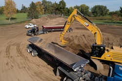 Cat 340 hydraulic excavator loading a truck
