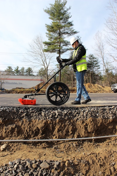 GSSI UtilityScan DF pushcart pushed by worker on road detects underground utilities