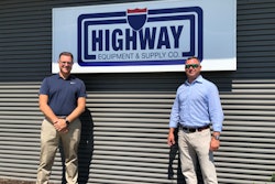 Highway Equipment & Supply Co. owners in front of company sign