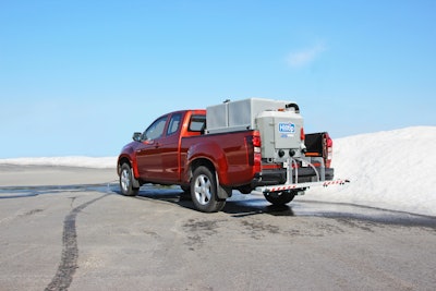 Hilltip SprayStriker 2600 mounted to back of red pickup truck