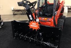 Kubota snowblower attachment on skid steer in showroom