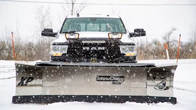 SnowDogg snowplow on Ram medium-duty truck in snow