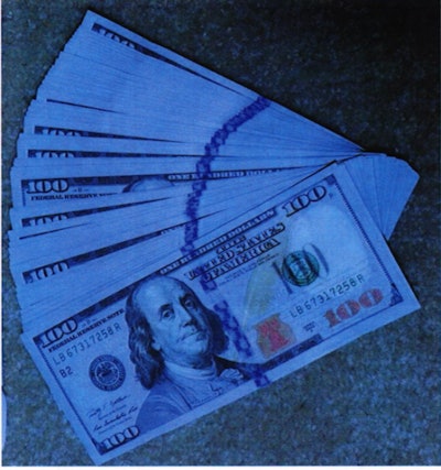 100 dollar bills spread out to illustrate Caltrans bribery and bid-rigging scheme