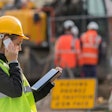 Female construction worker using tablet