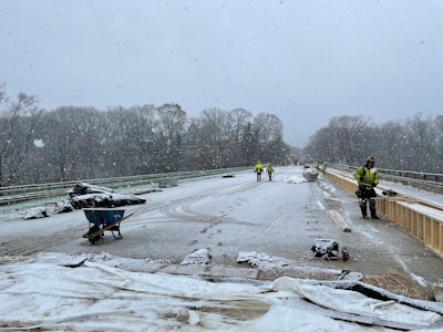 Fern hollow Bridge replacement project snow falls on workers