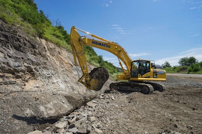 Komatsu HB365-3 hybrid excavator digging.