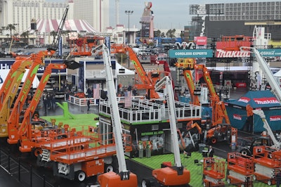 World of Concrete 2022 outdoor lot with boom lifts raised
