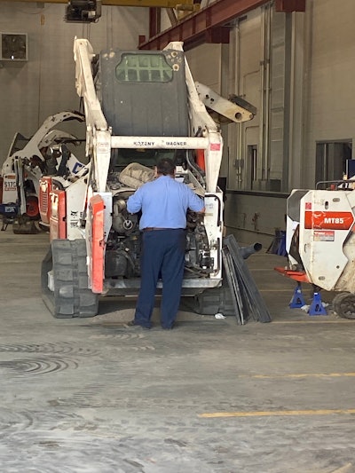 Technician working on Bobcat CTL