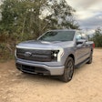 Ford F-150 Lightning parked in dirt area