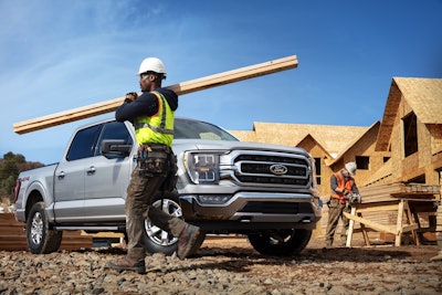 Ford F-150 pickup truck working carrying lumber
