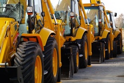 Backhoe loaders parked in a row