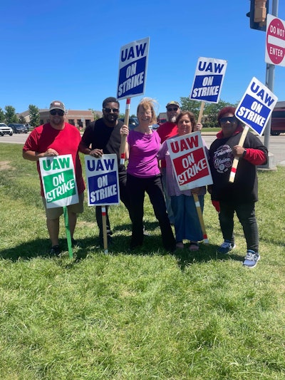 Rep. Tammy Baldwin with striking workers on picket line in Racine