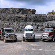 3 Mack Granite vocational trucks black dump truck white cement mixer red dump truck