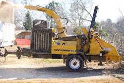Vermeer AX17 brush chipper throws debris into a trailer