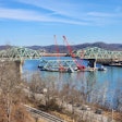 main span of Legg Memorial Bridge in West Virginia lowered onto barges to be recycled