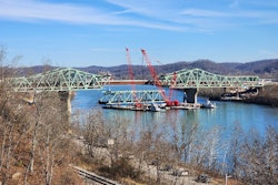main span of Legg Memorial Bridge in West Virginia lowered onto barges to be recycled