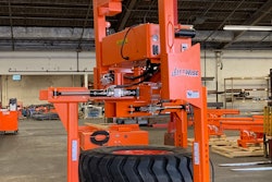 orange LiftWise Hanging Tire Handler with large tire clamped