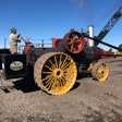 1918 Russell steam tractor running belt to drive old-time rock crushing demonstration