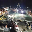 night time aerial view of work to build park over I-579 in Pittsburgh