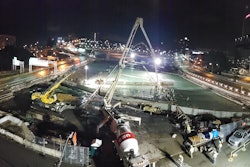 night time aerial view of work to build park over I-579 in Pittsburgh