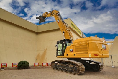 Cat 352 Straight Boom Excavator demolishing a building