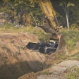 Movex Track-O M-47 Minidozer lowered into trench in excavator bucket