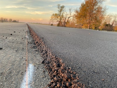 asphalt road newly paved with Oxclaw screed plate