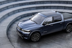 Ram 1500 Rev electric pickup at base of circular concrete stairs