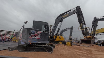 Custom-wrapped Cat excavator at the Engcon booth owned by Dane Cotten of DC Excavation in Belgrade, Montana.