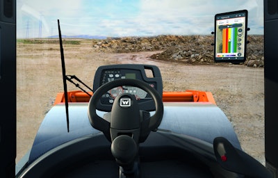interior view of compactor with Hamm Smart Doc app displayed on windshield