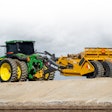 K. A. Group’s Ashland 1812E pull-behind scraper with a John Deere tractor