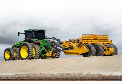 K. A. Group’s Ashland 1812E pull-behind scraper with a John Deere tractor