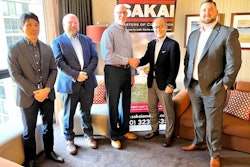 Executives from Sakai and Taylor Construction Equipment
